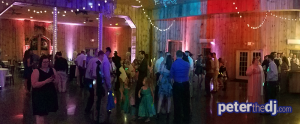 A panoramic shot to show the white and coral uplighting (contrasting with the changing colors of the dance floor lights)