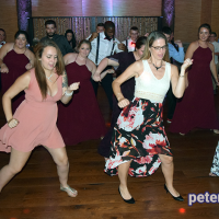 Guests dancing at Emily and Nick's wedding at Tailwater Lodge, Altmar, NY. Photo by DJ Peter Naughton. October 2018